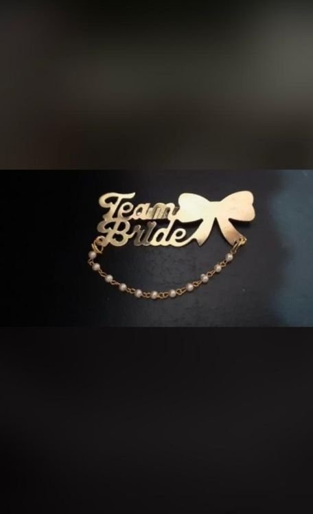 Team bride brooch