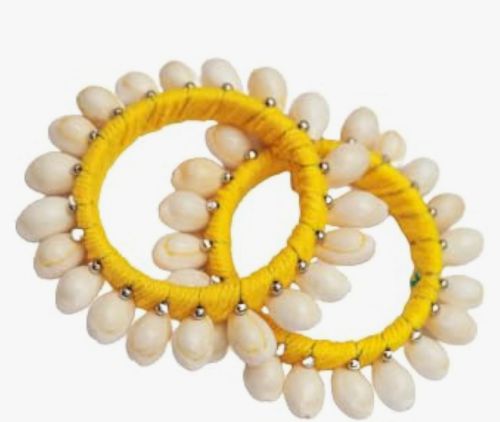 Shell bangles in yellow colour